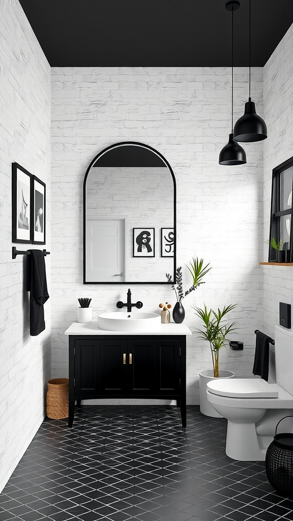 A stylish black and white bathroom featuring a modern sink, black cabinetry, and decorative plants.